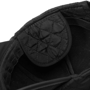 Macro view of men winter baseball cap with diamond quilted lining and windproof seam detail