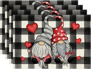 Close-up of linen Valentine placemats featuring gnome couple and red hearts in a set of 4