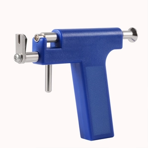 Professional blue ear piercing gun with stainless steel components on white background
