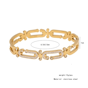 Detail of 1cm wide gold hollow bangle with clear rhinestones and size specifications