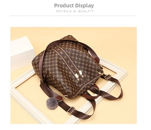 Close-up of brown monogram backpack featuring gold zippers and a grey fur pompom charm