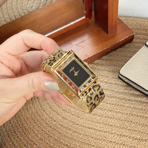 Elegant gold rectangular watch with leopard print mesh strap and black dial