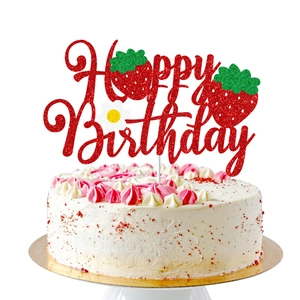 Red glitter Happy Birthday cake topper with strawberry accents on cream cake