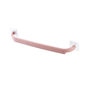 Pink wall-mounted towel rack with adhesive pads for drill-free bathroom storage
