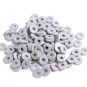 Macro shot of 6mm grey flat clay spacers for DIY jewelry making and bracelet beads crafts