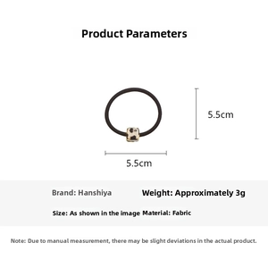 Close-up of leopard print resin cube bead on a black elastic hair tie with 5.5cm diameter