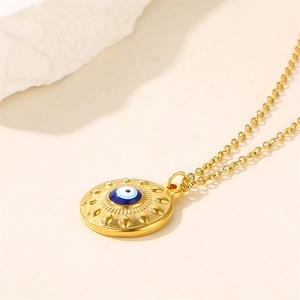 Golden necklace featuring a blue Evil Eye circular pendant with a classic link chain