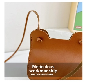 Detailed view of the bear ear design and precise stitching on the brown leather kids bag