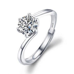 Macro shot of silver ring showing classic six-prong moissanite setting and S925 stamp