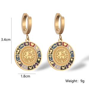 Detailed view of bohemian gold evil eye earrings with enamel finish and size dimensions