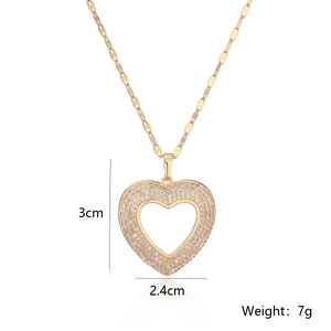 Detail showing 3cm x 2.4cm heart pendant with white zircons and gold chain weight 7g