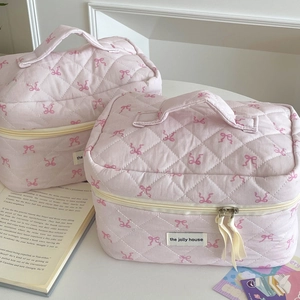 Sweet pink quilted makeup bag with ribbon bow patterns and soft top handle for women