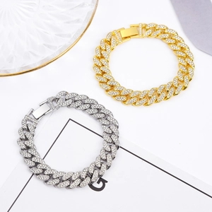 Detail of hip hop Cuban link bracelets in gold and silver with full iced-out rhinestones