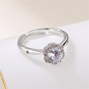 Elegant silver flower ring with round zircon and sparkling petal halo in a 45-degree view
