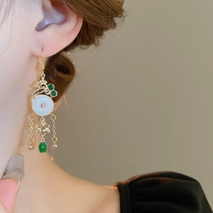 Detailed close-up of Neo-Chinese tassel earrings featuring imitation jade and gold accents