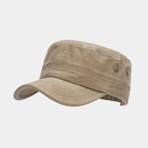 Close-up of khaki cadet cap side showing metal ventilation eyelets and stitching