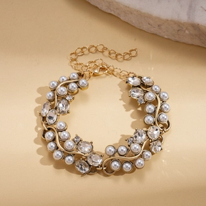 Detail of adjustable lobster clasp and extension chain on a pearl and crystal bracelet