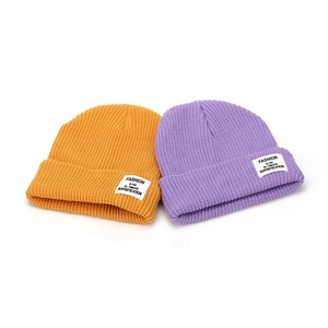 Unisex ribbed knit beanie hats in ginger yellow and lavender purple with folded cuffs