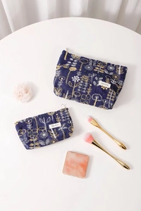 Detailed embroidery on blue cotton linen cosmetic bags with premium zipper closure