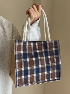 Canvas checkered tote bag with brown and blue plaid pattern and cotton rope handles