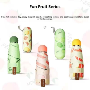 Variety of portable fruit print mini umbrellas with matching hard-shell storage cases