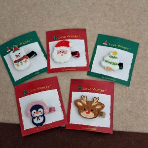 5-piece set of embroidered Christmas hair clips featuring Santa, reindeer and tree themes