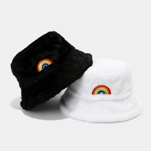Furry bucket hats with rainbow embroidery in black and white plush faux fur