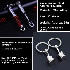 Detail view of zinc alloy shock absorber and piston car keychains with dimensions