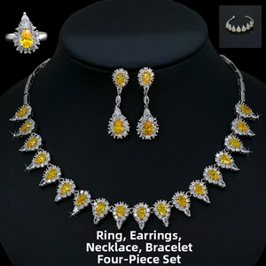 Exquisite bridal jewelry set featuring yellow pear-cut stones and crystal halo details