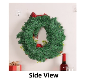 Side view of festive Christmas wreath with red plaid bow and red berry accents