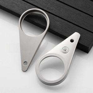 Macro view of teardrop stainless steel bottle openers with engraved wine character