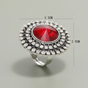 Vintage silver adjustable ring with large red faceted stone and halo diamonds