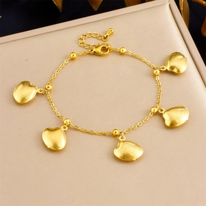 Detail of golden stainless steel chain featuring five striped scallop shell charms