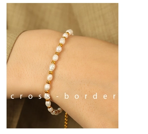 Close-up of vintage Baroque pearl bracelet with gold beads on model's wrist