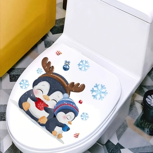 Detail of Christmas penguin toilet stickers with snowflakes and festive ornaments