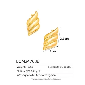 Macro view of wave textured 18K gold plated stainless steel earrings with size specs