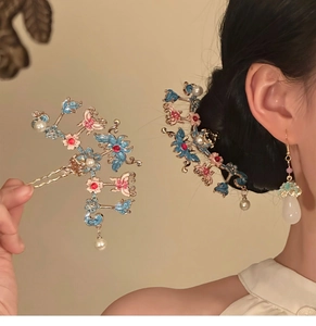 Détails d'épingles à cheveux papillon élégantes avec émail bleu et perles