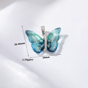 Detail view of butterfly pendant with 20.45mm height and 24mm width dimensions shown