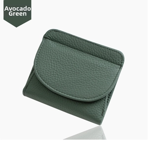 Macro shot of jade green pebble leather wallet with detailed stitching and texture