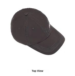 Top view of a charcoal cotton baseball cap featuring a curved brim and a side metal badge