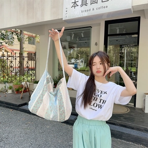 Floral print canvas tote bag with spacious interior and shoulder strap for daily shopping
