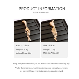 Detailed view of golden leaf brooch sizes 14x3.3cm and 15x4cm with weight specs