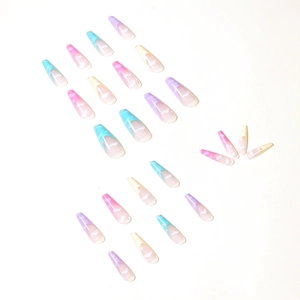 Rainbow gradient coffin press-on nails with white cloud patterns on white background