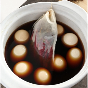 Disposable non-woven herbal tea filter bags for spices and herbs in a cooking pot