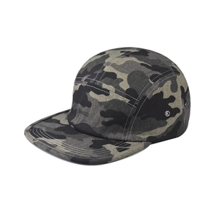 Detail view of five-panel camo camper hat featuring metal eyelets and flat brim design