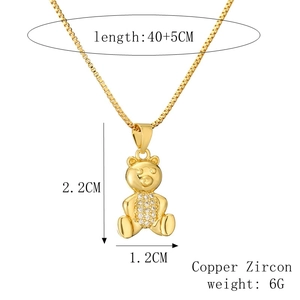 Detail view of gold bear pendant necklace with 2.2cm height and zircon inlay specifications