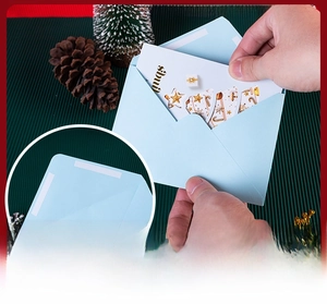 Detail showing self-adhesive seal on light blue envelope for 3D Christmas card sets