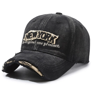 Vintage distressed black denim baseball cap with New York embroidery at 45-degree angle