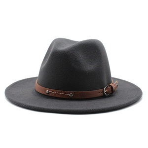 Detailed view of the dark grey fedora with brown leather band and metallic buckle accents