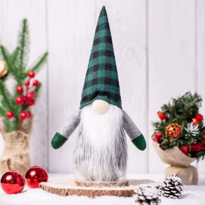 Nordic Christmas gnome with green plaid hat and white beard on a festive wooden base